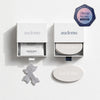 Audemu premium sleep optimization products in minimalist white packaging with soft natural lighting, featuring nasal strips and sleep strips on a clean luxury background and with sleep score validated in scientific research badge.