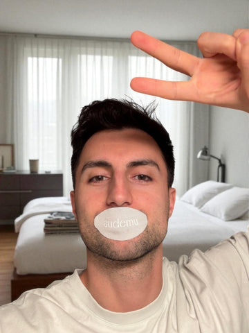 Audemu Sleep Strip – A man tests premium mouth tape in the bedroom to improve nasal breathing, reduce snoring, and ensure restful nights.
