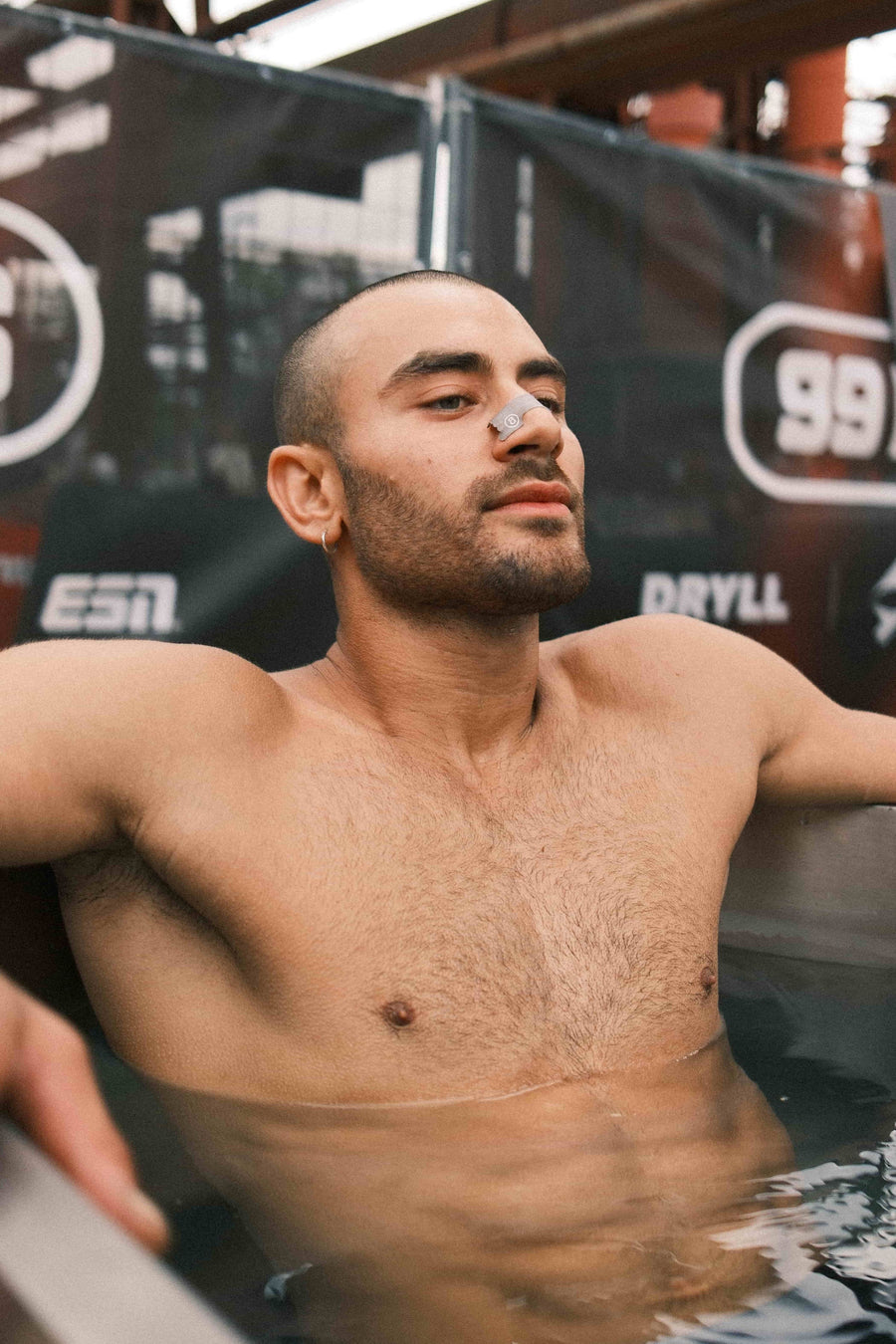 Man wearing Audemu nasal strip in ice bath for recovery after running