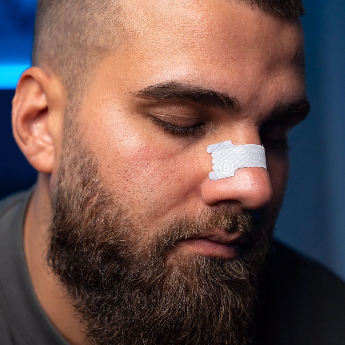 male-person-with-beard-wearing-audemu-nasal-strip-on-nose