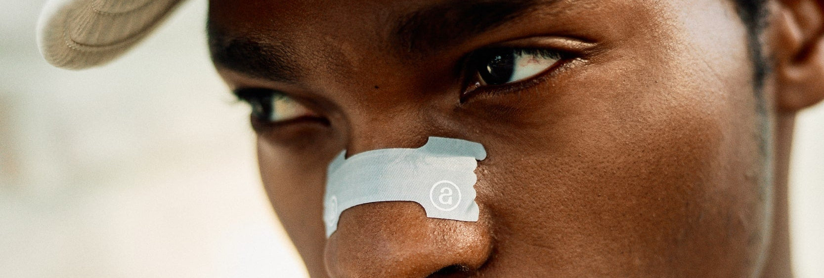 audemu-website-banner-athlete-with-nasal-strip-breathing-exercising